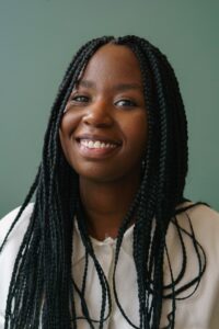 Smiling black woman with braids